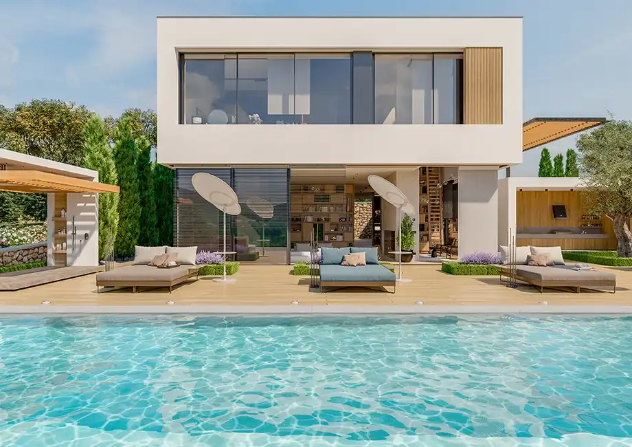 Villa moderna con piscina y tumbonas bajo un cielo despejado.